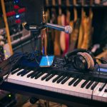 Music production setup with synthesizer keyboard